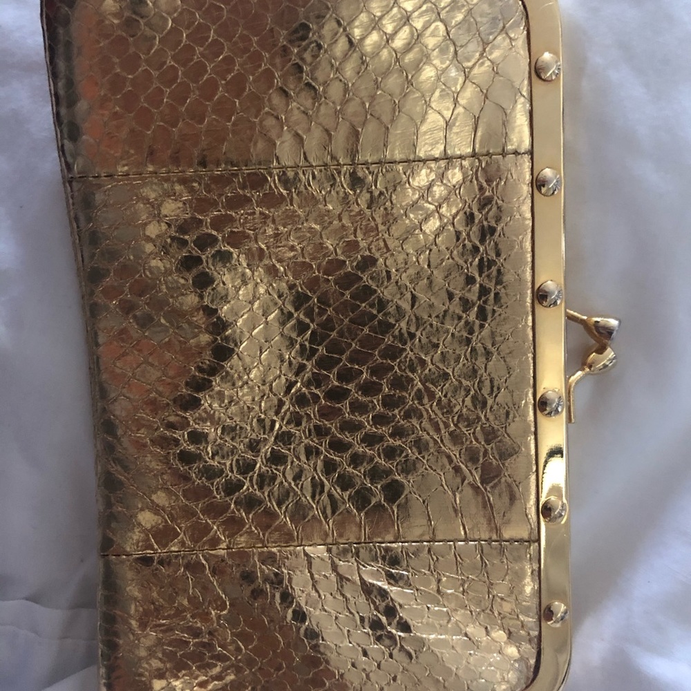 Gold cache clutch used but in good condition